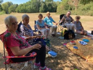 Image of French conversation members having a picnic